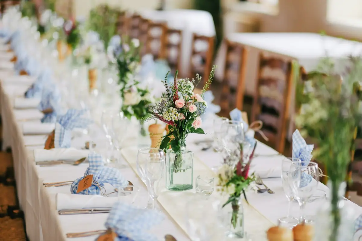 Long table decorated with flowers for a celebration