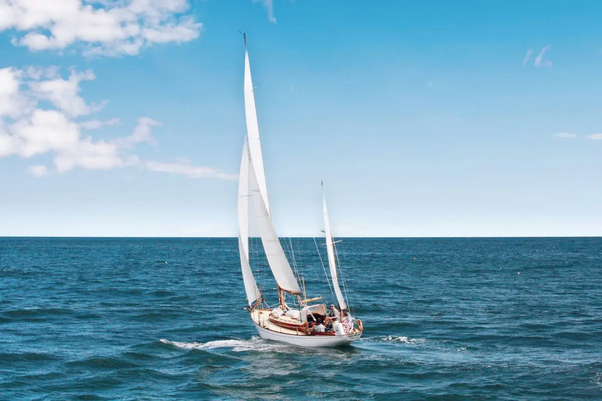 Sailing yacht heeling in the breeze on a bright day